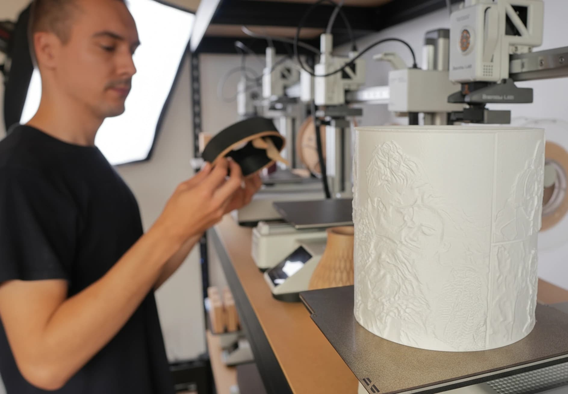 Domagoj Krakan at Memoria Lights studio working on a glowing personalized 3D printed photo lamp.